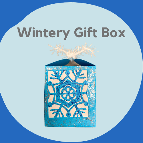 A paper box decorated with snowflakes and glitter.