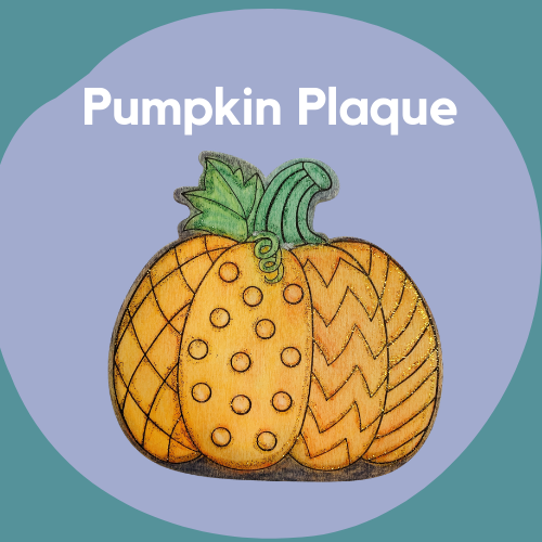 A thin wooden pumpkin plaque decorated with colors and glitter